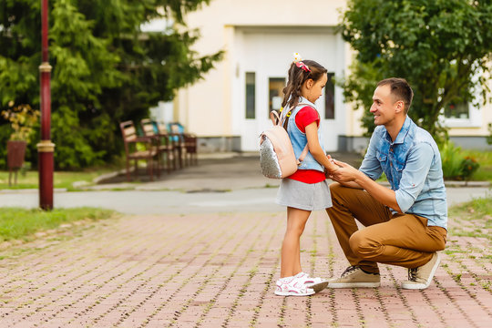 man dropping off daughter