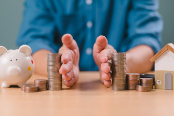 money and house with man dividing them