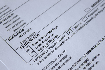 A close-up of a legal document titled "PETITION FOR" with checkboxes for dissolution of marriage, legal separation, and nullity of marriage. The dissolution box is checked. The form includes fields for petitioner information. divorce complaint
