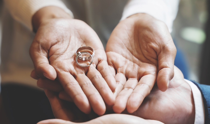 Judge gavel with pair of marriage ring Divorce concept