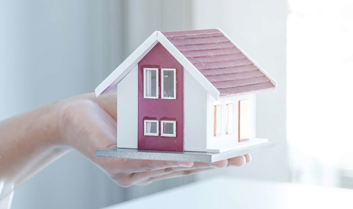 The real estate agent explains the business contract rent purchase mortgage a loan or home insurance to the women buyer