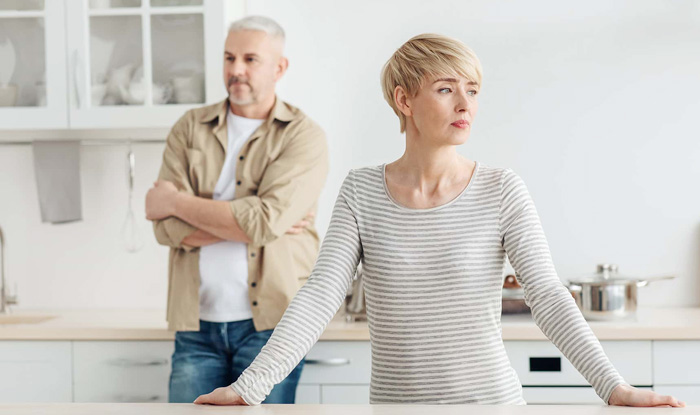 disgrunted couple in the kitchen