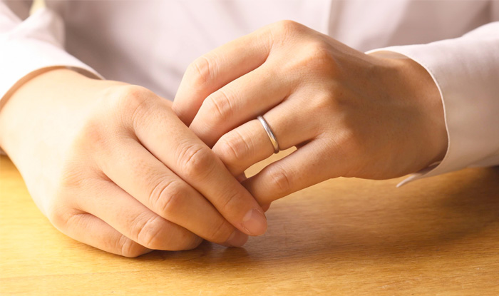 hands focusing on wedding ring