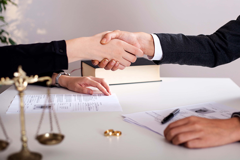 handshake over divorce documents