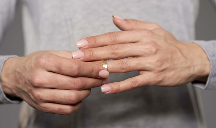 man removing wedding ring