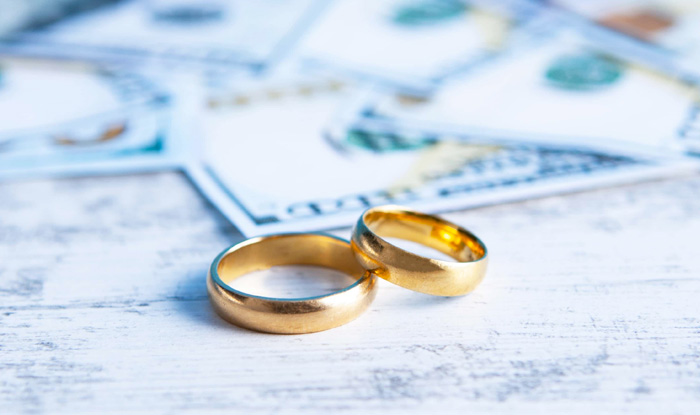 wedding rings sitting table with money