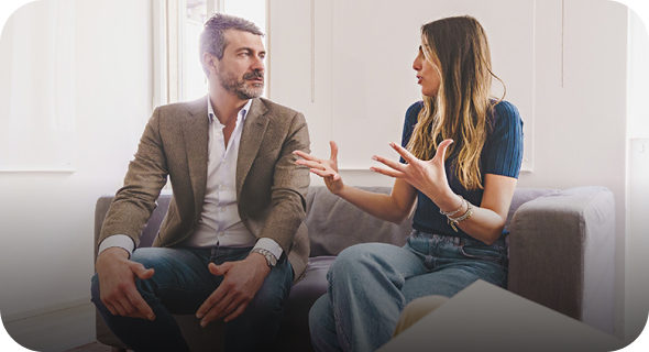 couple talking on a couch