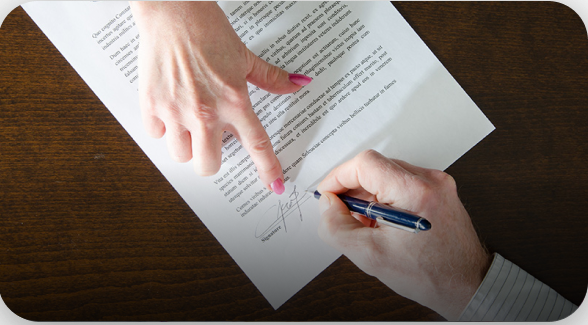 person signing a legal document