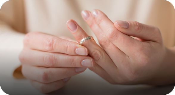 woman removing wedding ring