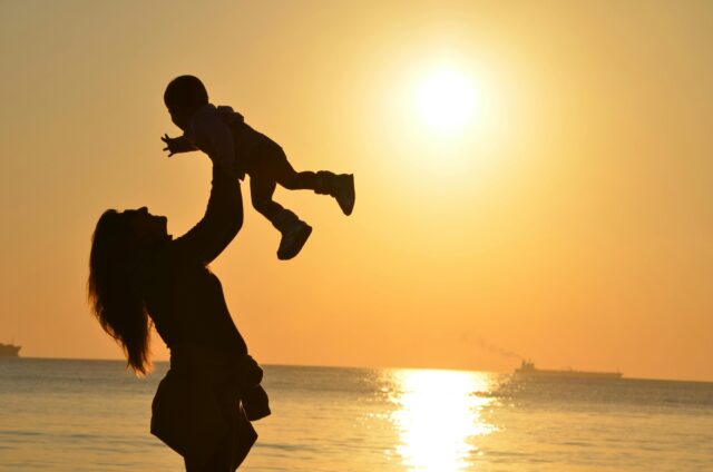 mother and child with sunset