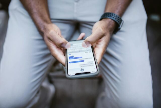 man texting on phone